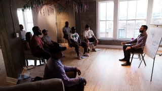 Coach John Marshall leading meditative exercise turning a Team Resilience Workshop